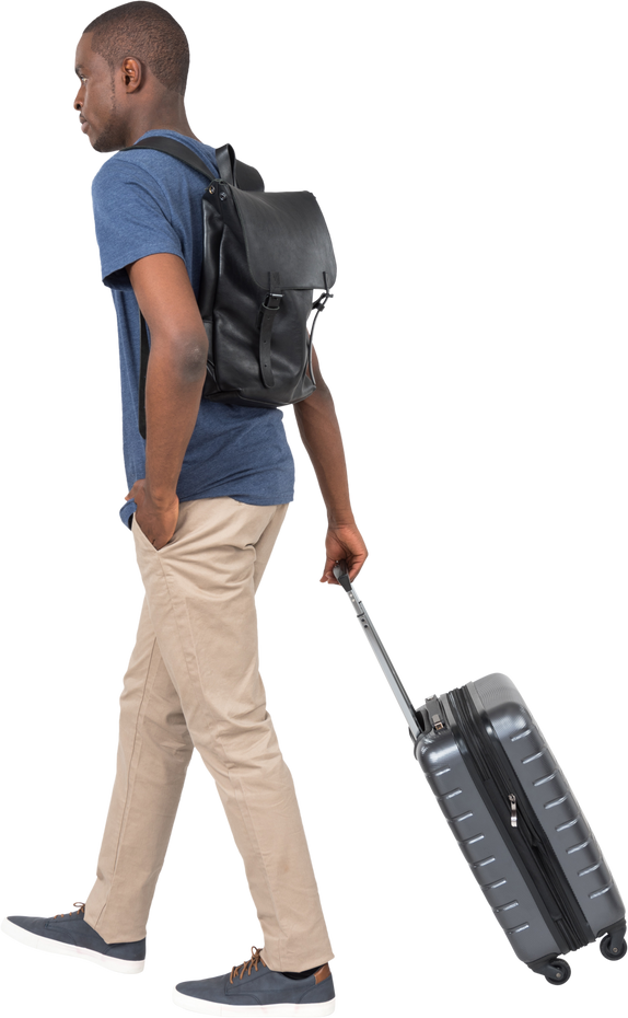 Man Carrying a Backpack and Dragging a Suitcase